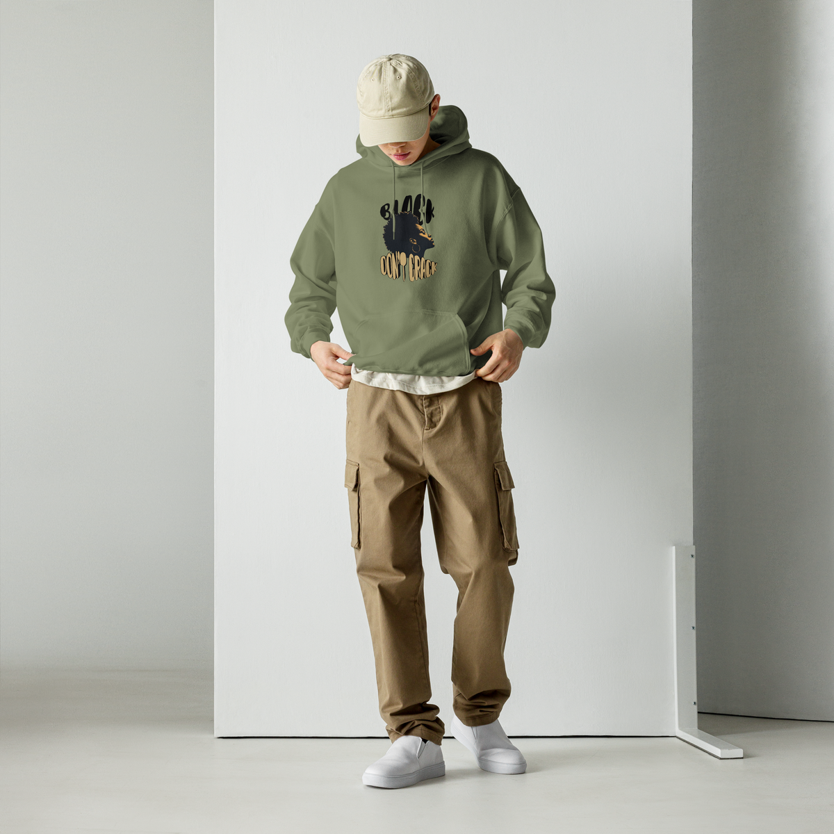 Black Don't Crack on a military green hoodie, worn front view